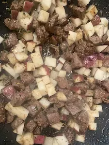 Deer-meat-mixed-with-potatoes-and-seasoning
