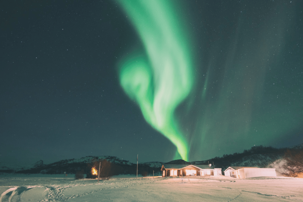 Aurora over house in Alaska