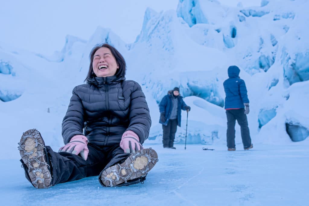 Having A Fun Time Sliding On The Matanuska Glacier